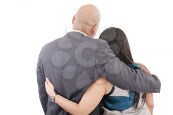 Back view of couple hug and look into a distance. formal guy and beautiful woman together. Rear view. Isolated.