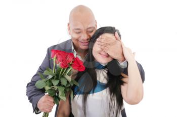 Man offering a bouquet of red roses to a woman 