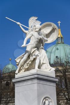 Royalty Free Photo of a Statue by a Cathedral