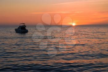 Royalty Free Photo of a Boat at Sunset