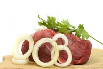 Royalty Free Photo of Meat on a Cutting Board