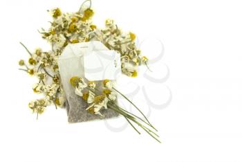 Royalty Free Photo of a Teabag and Flowers