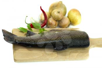 Royalty Free Photo of a Fish on a Cutting Board