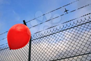 A red balloon in danger