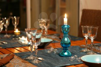 warm celebration table, focus on candlestick