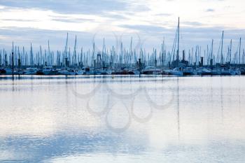 Masts of sailing boats moored in marina near Saint Malo