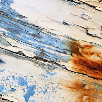 Boards of old boat with peeling paint background texture