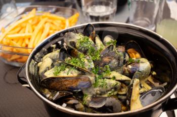 mussel and french fries at the restaurant