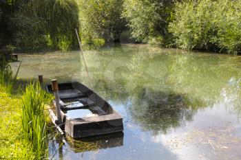 Small boat in marshes in Bourges, Berry province, Centre-Val de Loire, France