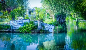 Signs in the water, marshland in Bourges, France