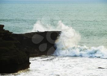 Ocean wave breaking against the rock, Tanah Lot, Bali, Indonesia