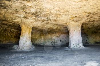 Cala Morell Necropolis Cave interior with columns at Menorca, Spain.