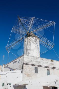 The Moli des comte (Count's Mill) in Ciutadella, Menorca, Spain. This corn wind mill was built in 1762 and was preserved in fine state  to this day.