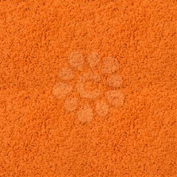 Seamless orange fitted carpet texture.