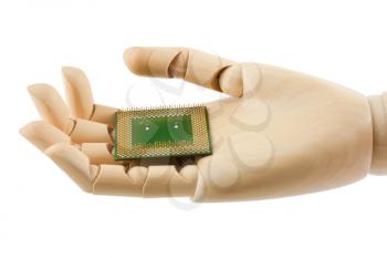 Royalty Free Photo of a Wooden Dummy Hand Holding onto a Microchip