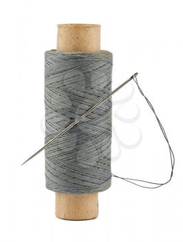 Royalty Free Photo of a Spool of Thread and Needle