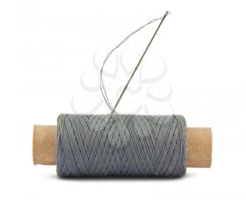 Royalty Free Photo of a Spool of Thread and Needle