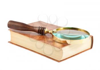 Royalty Free Photo of a Magnify Glass Sitting on Top of a Book