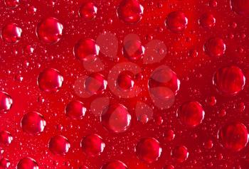 Royalty Free Photo of a Closeup of Water Drops on a Colored Background
