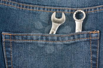 Royalty Free Photo of Two Wrenches in a Denim Jean Pocket