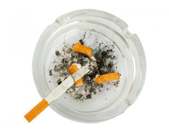 Royalty Free Photo of a Cigarette and Ashtray