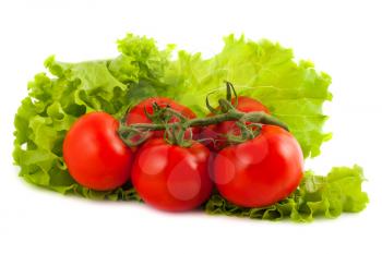 Royalty Free Photo of a Bunch of Tomatoes on a Lettuce Leaf