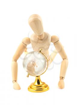 Royalty Free Photo of a Concept of a Wooden Dummy Looking at a Globe