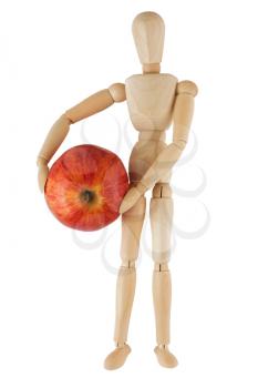 Royalty Free Photo of a Wooden Mannequin Holding a Ripe Apple