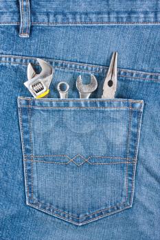 Royalty Free Photo of Several Tools in a Jean Pocket