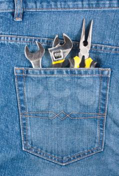 Royalty Free Photo of Several Tools in the Back Pocket of a Pair of Jeans