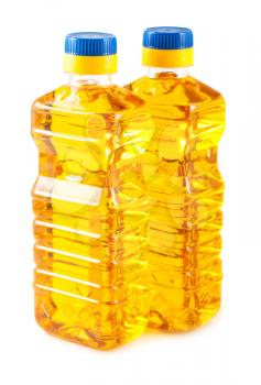 Two plastic bottles of sunflower oil isolated on white background
