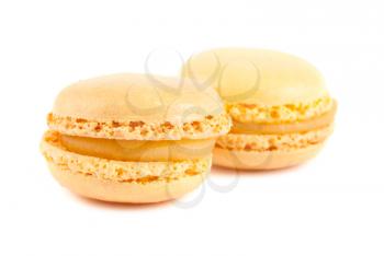 Pair of yellow french macaroons cake  isolated on white background