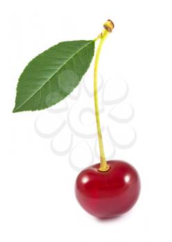 Sweet cherry with green leaf isolated on white background