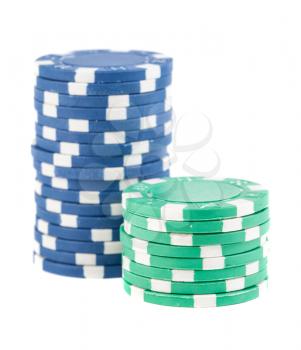Blue and green stacks of poker chips isolated on white background