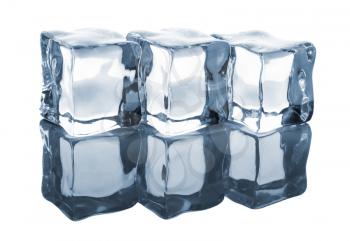 Three ice cubes on white background with reflection