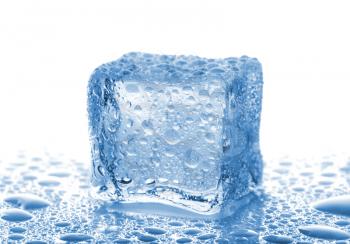 Single ice cube with water drops on white background