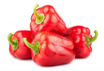 Heap of red sweet peppers isolated on white background