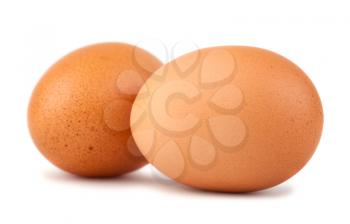 Two brown chicken eggs isolated on white background