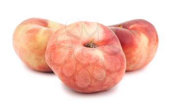Three paraguayos flat peaches isolated on white background