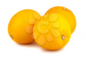 Three whole orange fruits isolated on white background