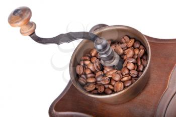Closeup vintage coffee grinder with coffee isolated on white background