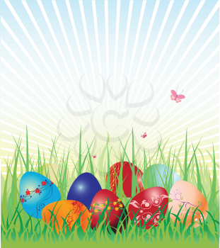 Royalty Free Clipart Image of Easter Eggs on Grass