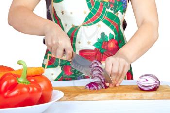 Royalty Free Photo of a Woman Cutting an Onion