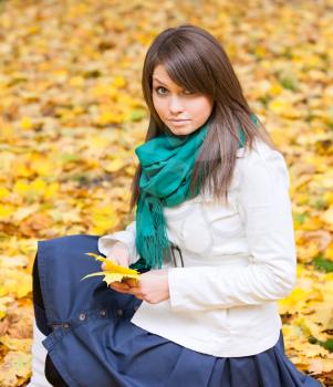 Royalty Free Photo of a Woman Sitting Outdoors