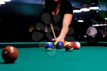 Royalty Free Photo of a Woman Playing Pool