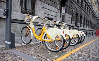 Royalty Free Photo of a Row of Bicycles for Rent in Milano, Italy