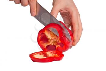 Royalty Free Photo of a Person Cutting a Pepper
