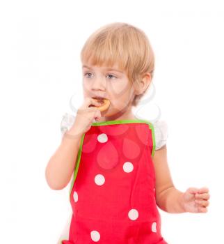 Little girl eating bagel isolated on white background
