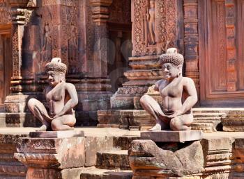 Ancient statues near the door in the temple Banteay Srei, Cambodia
