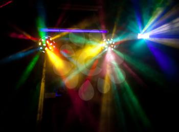 Abstract colorful disco lights in smoke
